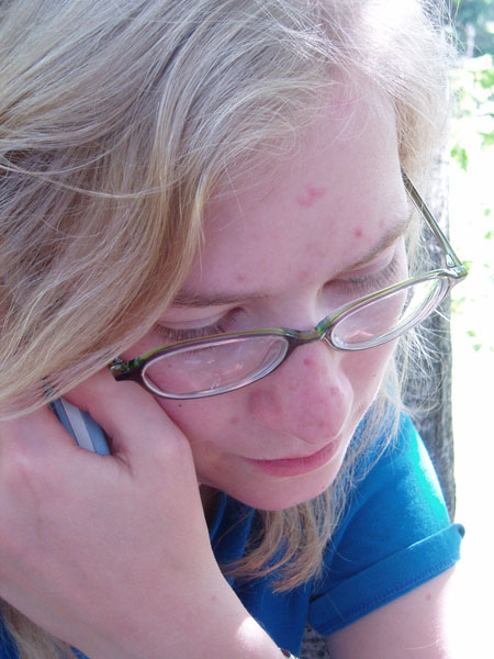 original picture of sarah on the phone in a tree